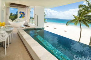 Open room with a pool with a beach view